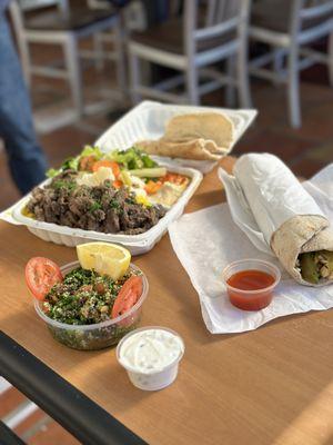 All the food we ordered. Garlic Chicken Wrap and Beef Shawarma Plate with Tabouli salad