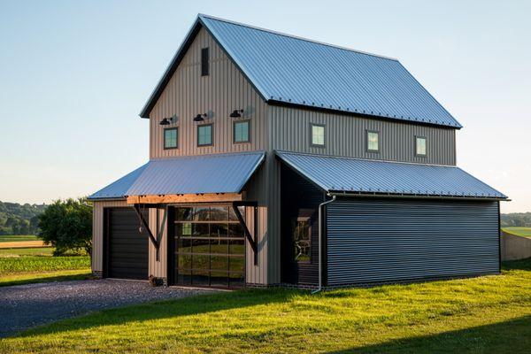 Anodized Black Haas overhead doors with full-view on new "retro" ag builidng.