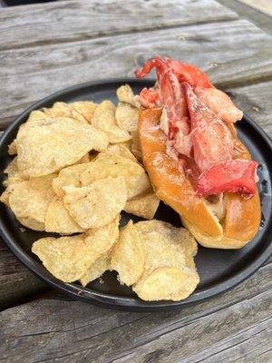 Lobster Roll + Chips w/ roasted garlic + truffle aioli, melted butter, house spice blend, lightly toasted split top bun $27