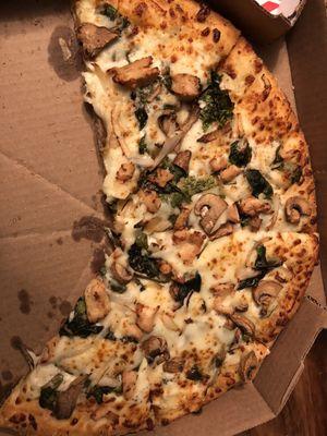 Hardly any toppings on a thin, doughy pizza with no flavor