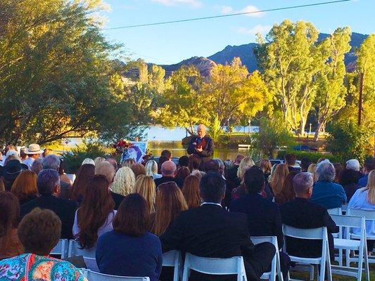 Service at Lake site with priest before cremation