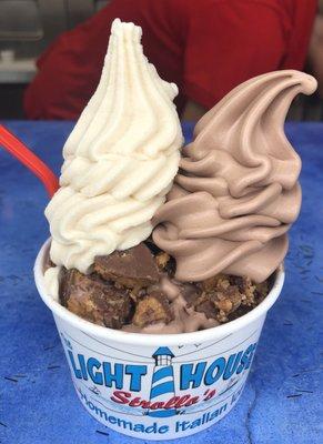 Chocolate soft serve and peanut butter Italian ice topped with Reese's good!