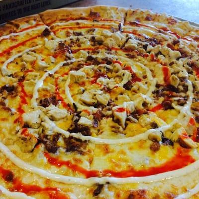 Game Time Pizza- chicken, apple wood smoked bacon crumbles, ranch, hot sauce, Cheddar, Monterey Jack, and mozzarella cheese.