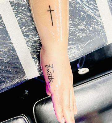 Retouched my cross tattoo and made it longer and better looking and my new faith tattoo ! Thanks Angel!