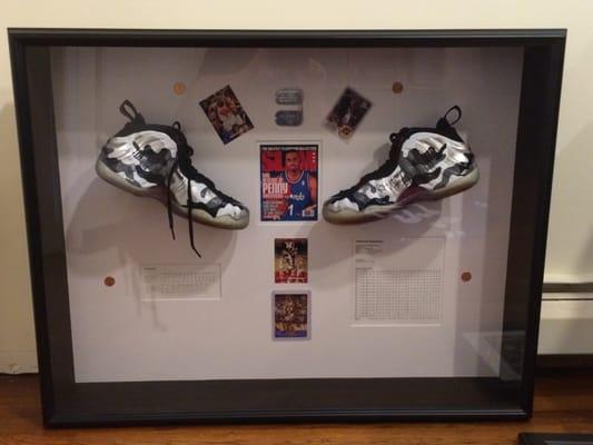 Here is another shadow box that we did. It contains signed sneakers by the NBA player, Penny Hardaway along with trading cards and coins