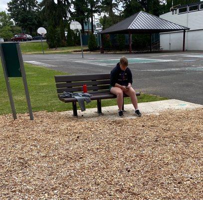 This is the preschool age group's summer camp counselor. Hard at work, texting.