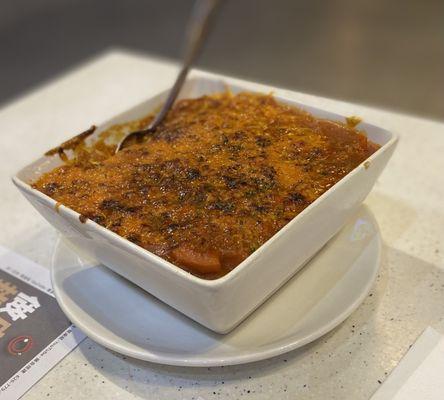 Baked pork chop in tomato sauce with rice. Really salty.