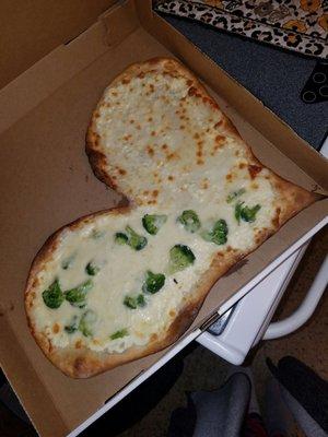 Our sad heart pizza with burnt/hard edges no spinach and only half had broccoli, not per our request.