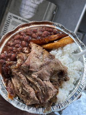 White rice with red beans, pork shoulder and some yellow plantains.