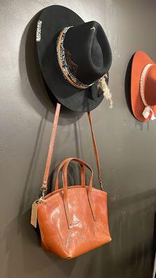 Custom branded wool hats and leather bags