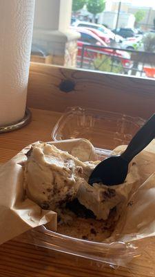 Warmed brownie topped with butter pecan ice cream