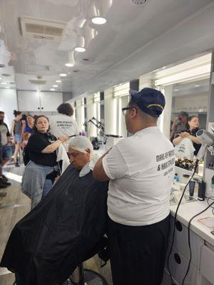 Hairstylists explain wigs & hairpieces they have used on set & did live hair demos, including creating a bald head on this man...