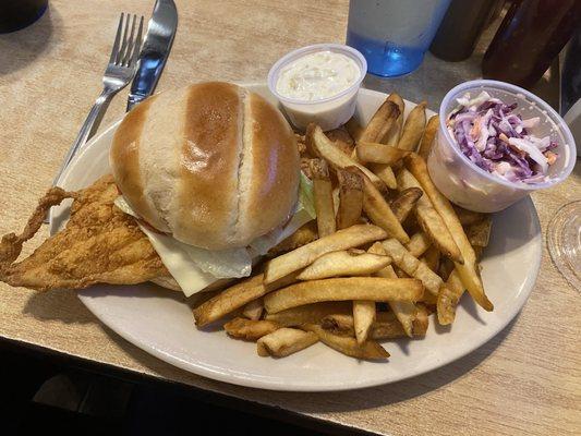 Fried Haddock Sandwich with fries and cole slaw.