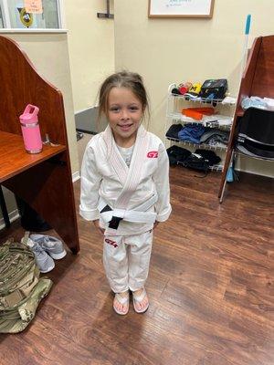 Emilia age 6 training BJJ for the first time at American Black Belt Academy.  She wanted to tie her own belt, sorry its wrong.