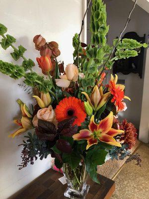 Fall bouquet with lilies, roses, bells of Ireland! Thank you Enchanted Florist!