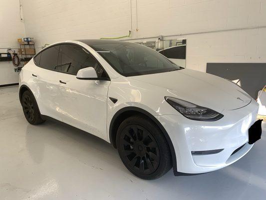 The Tesla Y tinted with ceramic window tint