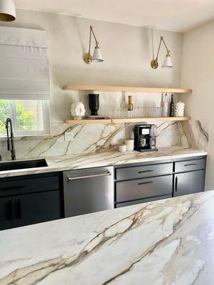 Porcelain Kitchen countertops, full back splash, under mounted sink, windowsill, and  a Eased Edge.