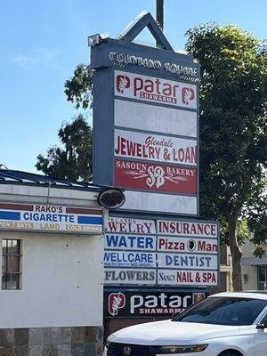 Looking east on Colorado, strip mall sign