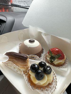 Mini eclair, mini blueberry tart, mini strawberry tart, tri chocolate mouse