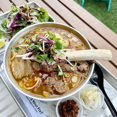 Spicy Vietnamese beef noodle soup served with brisket, beef rib, tendon, and Vietnamese ham