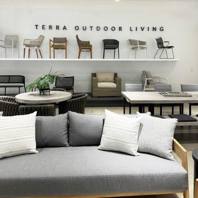 Chair wall with Cavallo teak sofa in foreground