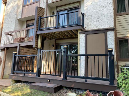 We tore down and replaced this clients two story deck with a beautiful,  composite deck with lights switchable lights on the step and post.