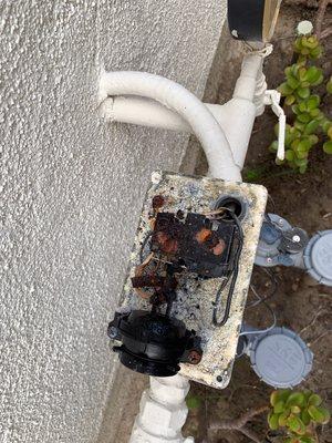 Corroded backflow alarm switch.