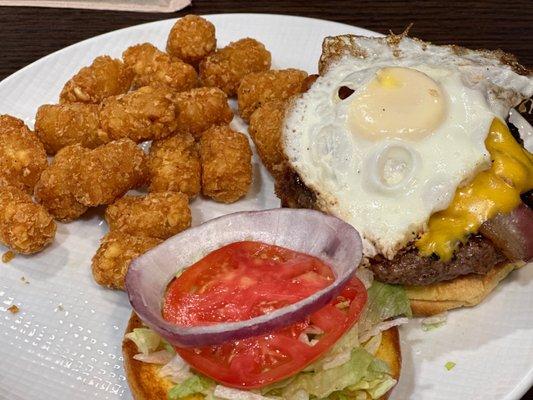 Hawks Burger with over easy fried egg and tots