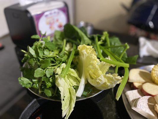 Water cress, spinach, and Napa cabbage.