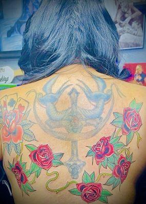 My 6 roses and vine to complete my back tattoo.