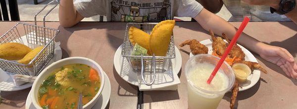 Empanadas, chicken soup, and coconut shrimp