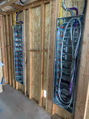 Structured media panel with wires wrapped for drywall prep protection.