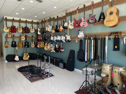 Our guitar wall and percussion section