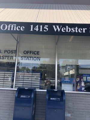 Blue drop off mailboxes in front