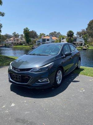 From the front, the Chevy Cruze showcases a bold grille and sharp headlights, making a strong first impression.