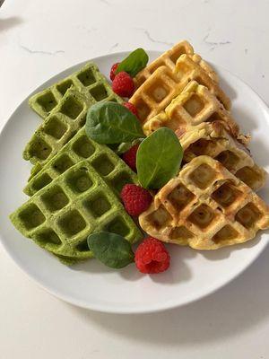 Spinach waffles, pumpkin waffles, and bananas with berries to choose from.