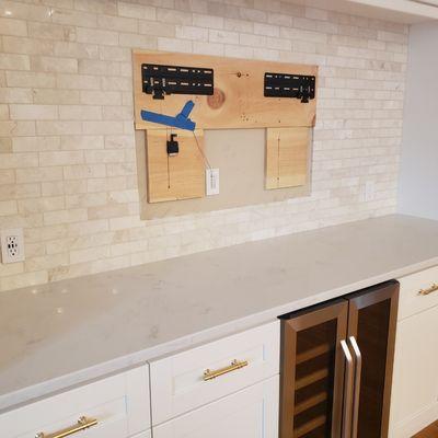 Quartz countertops and Marble backsplash