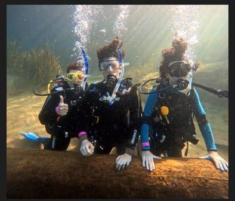 Three confident and now officially PADI certified scuba divers.