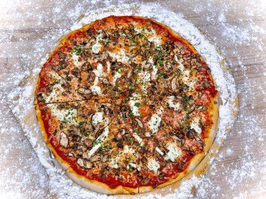 The Mushroom Lovers pizza! Freshly made bold sauce. Topped with ricotta cheese, a fresh mushroom medley, and parsley.