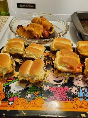 Home made cheese burger sliders with rolled up croissant hot .