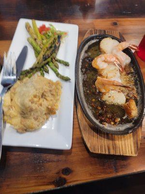 Broiled shrimp and scallop combo with mash potatoes and asparagus.