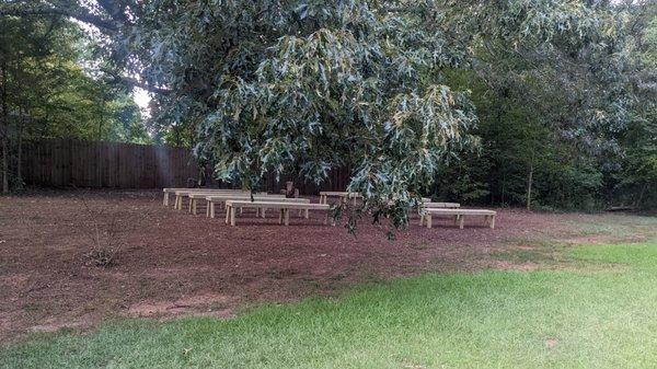 One of the gathering spots in the back, perfect for sharing vows under a 110 old tree