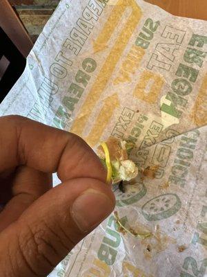 I saw a mixture of plastic nails inside the sandwich.