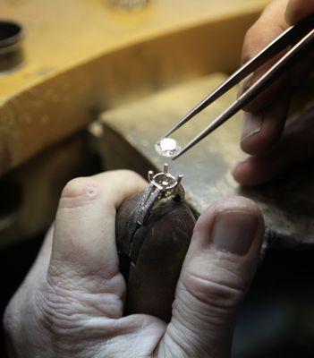 Greg at his bench pre- setting a diamond