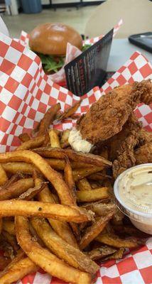 Chicken tenders with the most amazing tasting fries!!