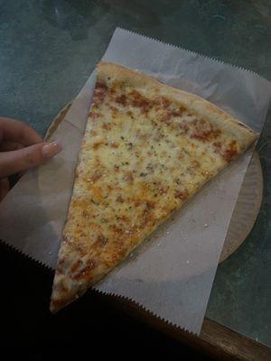 One beautiful slice of cheese pizza! Oh and my daughters hand