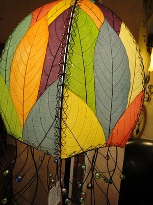 Jellyfish lamp made from cocoa tree leaves.  The leaves are fossilized and then stained with organic dyes.  Eco-friendly.