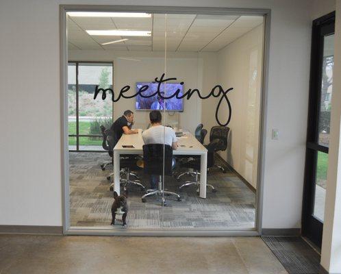 Our team members brainstorming in the meeting room.