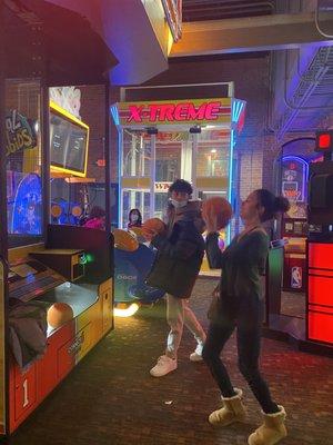 Teenagers playing the arcades, not as big as a Dave n Busters but same concept on a smaller yet comfortable level.