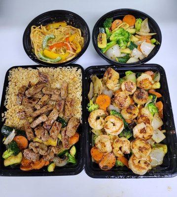 New York Steak and Fried rice (left Side) Shrimp, Scallops, and Double Mix Vegetables (right side)